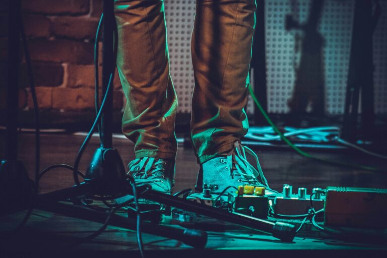 person standing beside black microphone stand